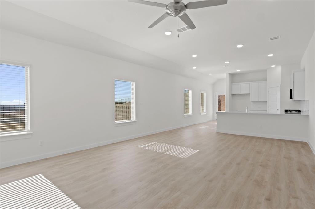 317 Millwood Road Lavon, TX 75166 - Photo 5 of 17 Living room in the Pecan II home plan by Trophy Signature Homes – REPRESENTATIVE PHOTO