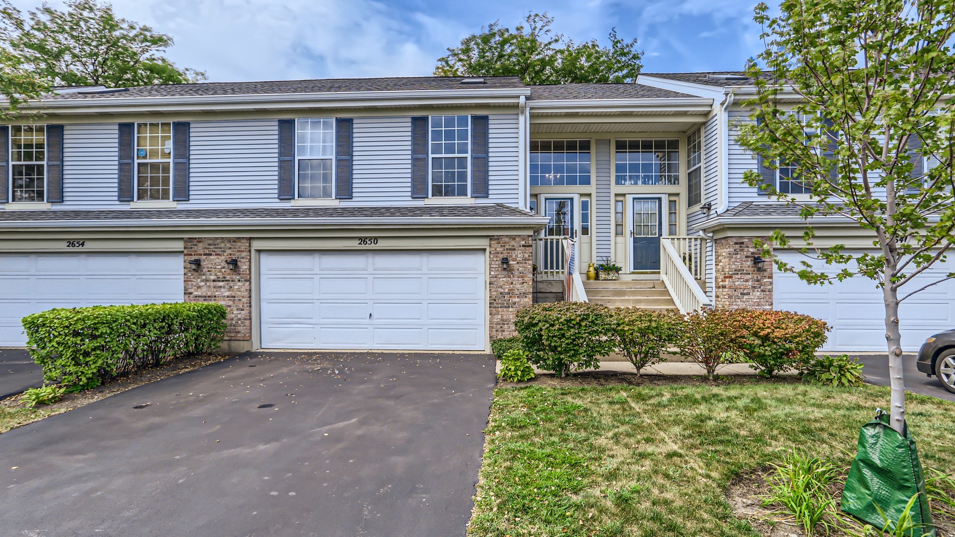 front view of a house with a yard