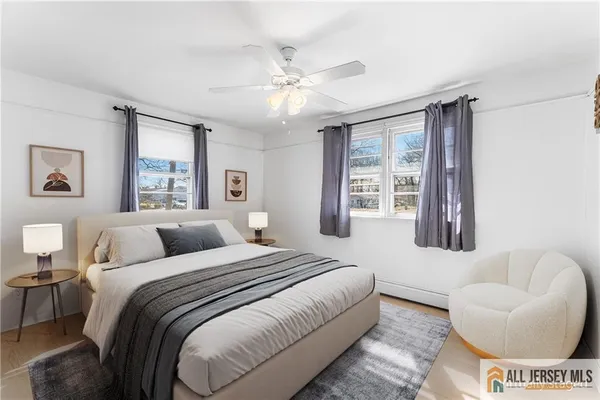 a bedroom with a bed and couch