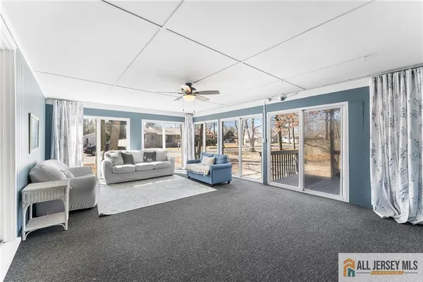 a view of livingroom with furniture and floor to ceiling window