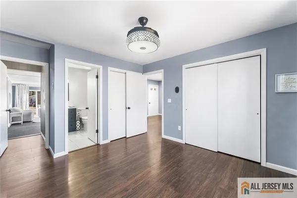 a view of an entryway with wooden floor