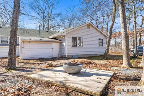 a view of a backyard of the house