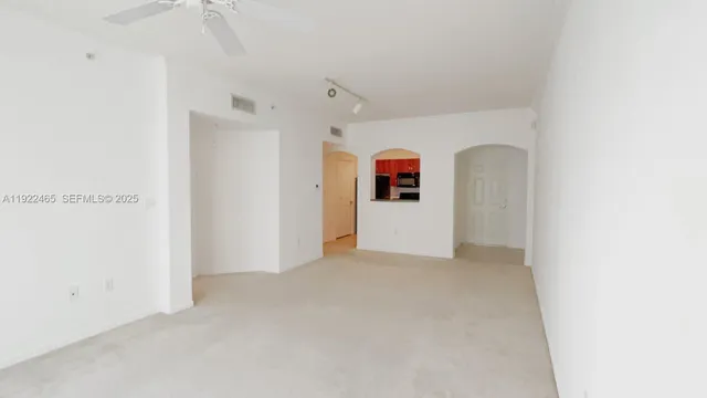 a view of living room with a sink and a mirror