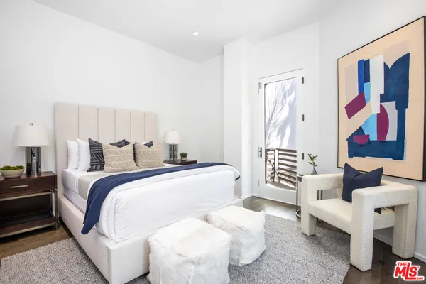 a bed room with a bed and furniture