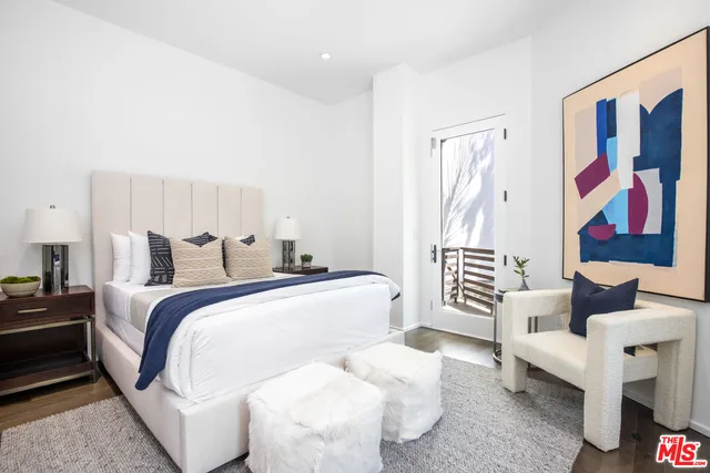 a bed room with a bed and furniture