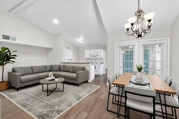 a view of a livingroom with a kitchen