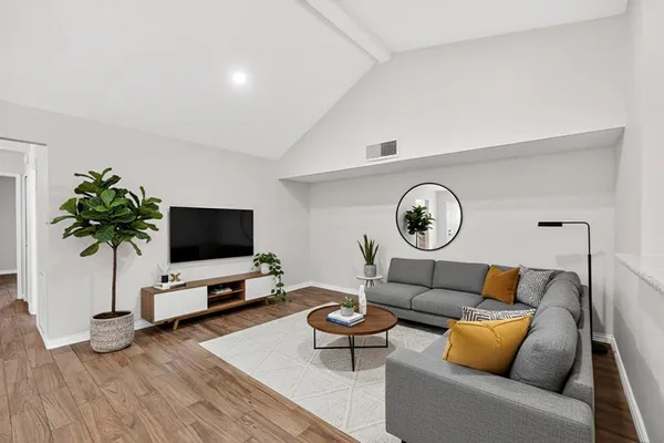 an empty room with wooden floor