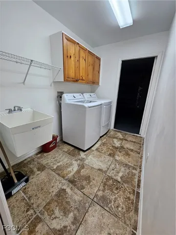 a room with a bed and flat screen tv