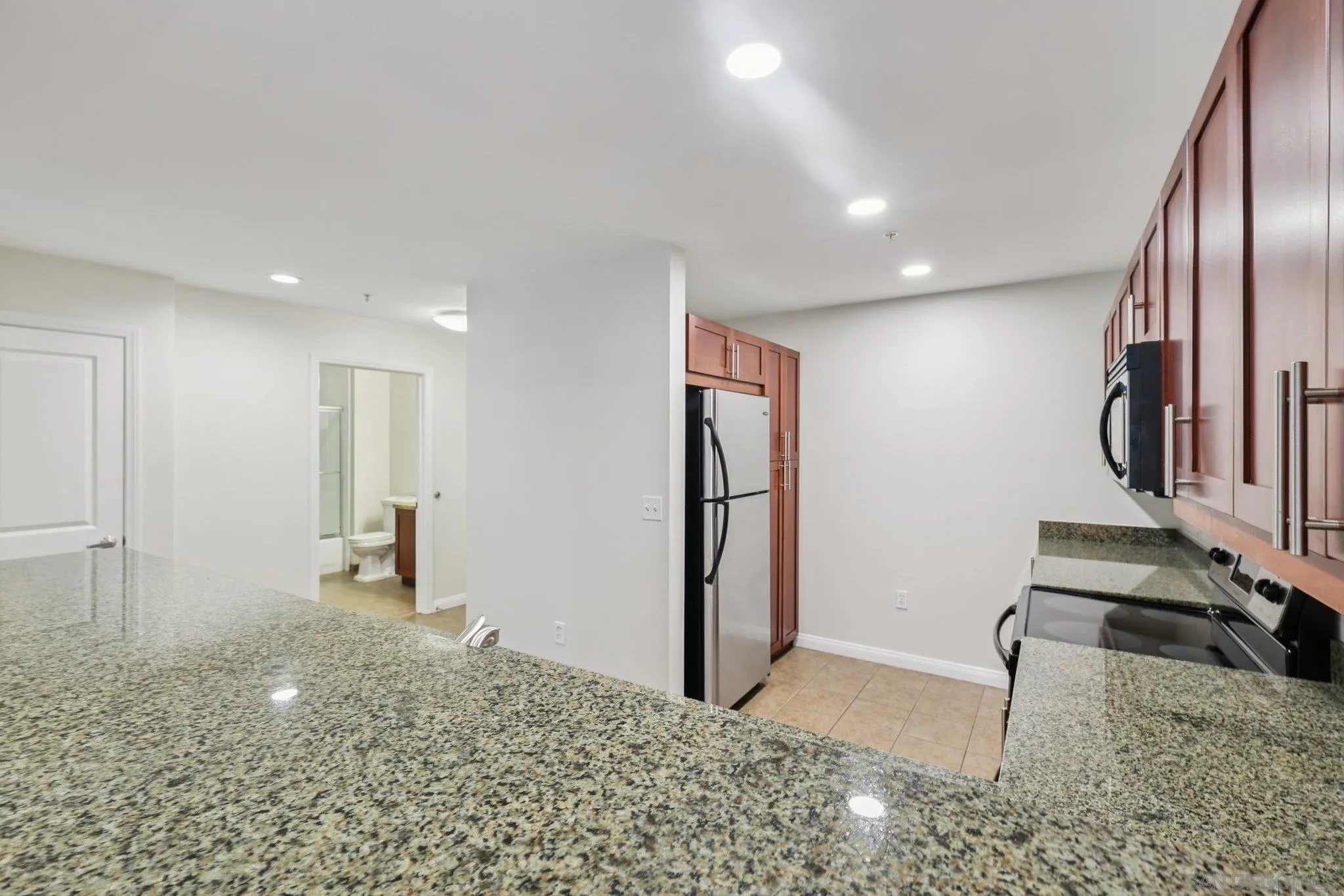 206 Park Boulevard, Unit 307 San Diego, CA 92101 - Photo 22 of 42 a view of a hallway with entryway and kitchen view