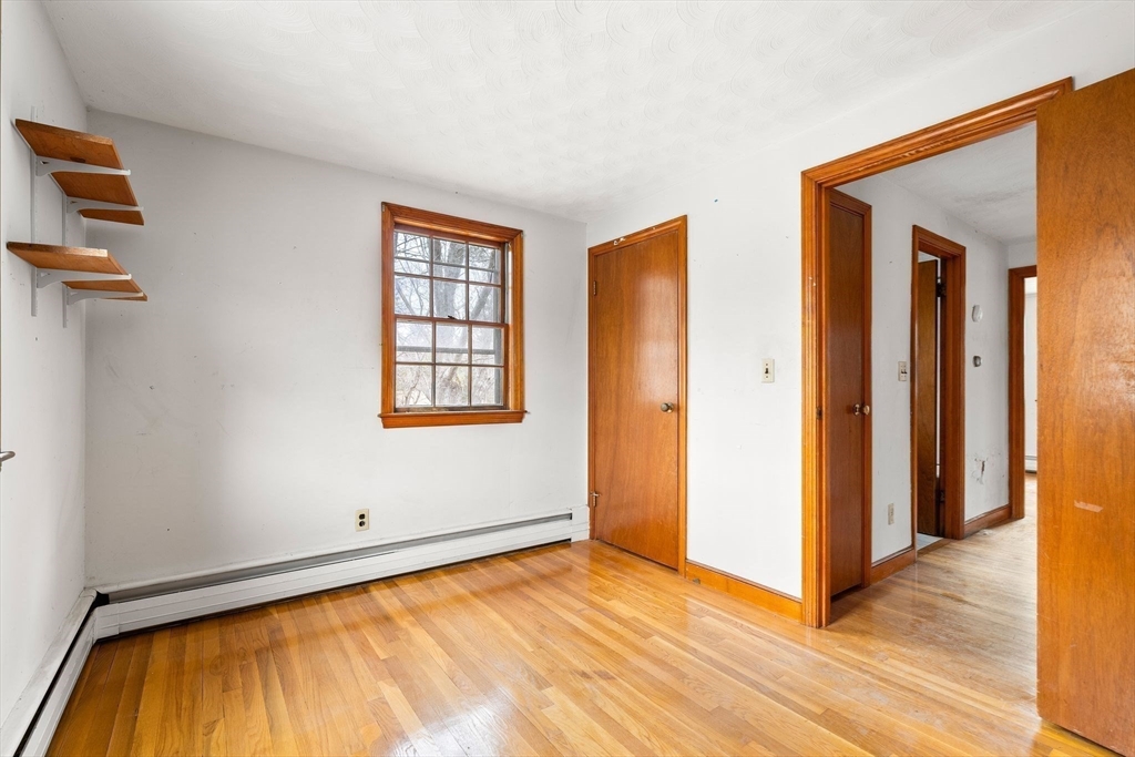 154 Birch Street Braintree, MA 02184 - Photo 21 of 38 a view of an empty room with closet and a window