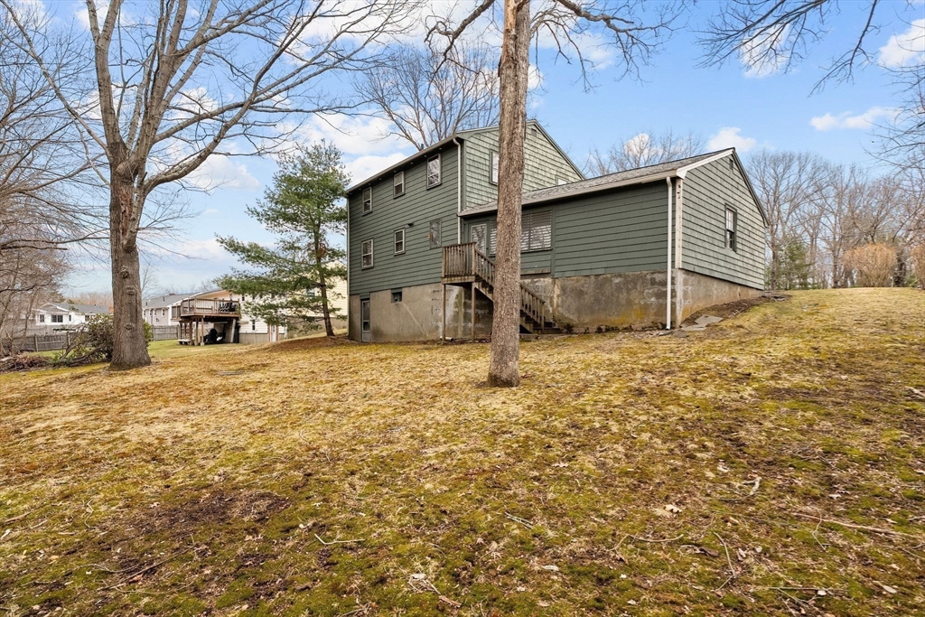 154 Birch Street Braintree, MA 02184 - Photo 31 of 38 a view of a house with a yard