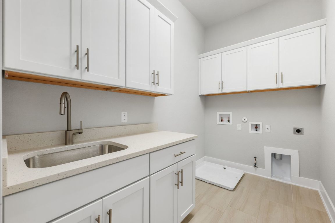 4323 Spicewood Springs Road, Unit 9 Austin, TX 78759 - Photo 28 of 31 Dedicated utility room with cabinetry and sink