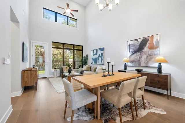 a dining room with furniture and wooden floor