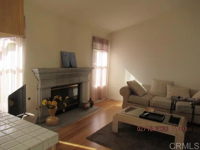 a view of an entryway with wooden floor