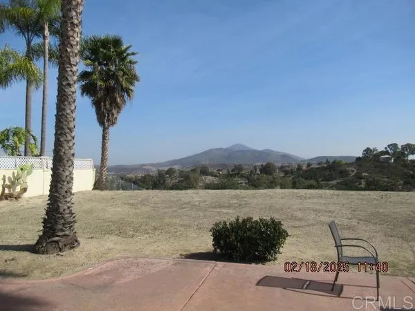 a view of a lake with mountain in the background
