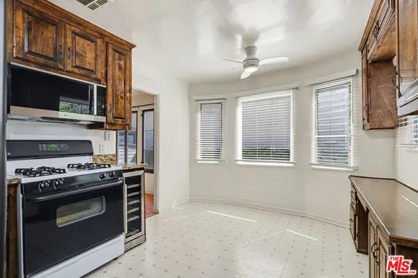 a kitchen with a stove and a microwave