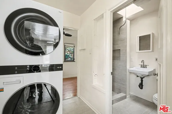 a view of bathroom with a sink and a mirror