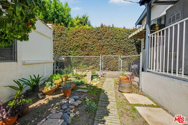 a view of a balcony with sitting area