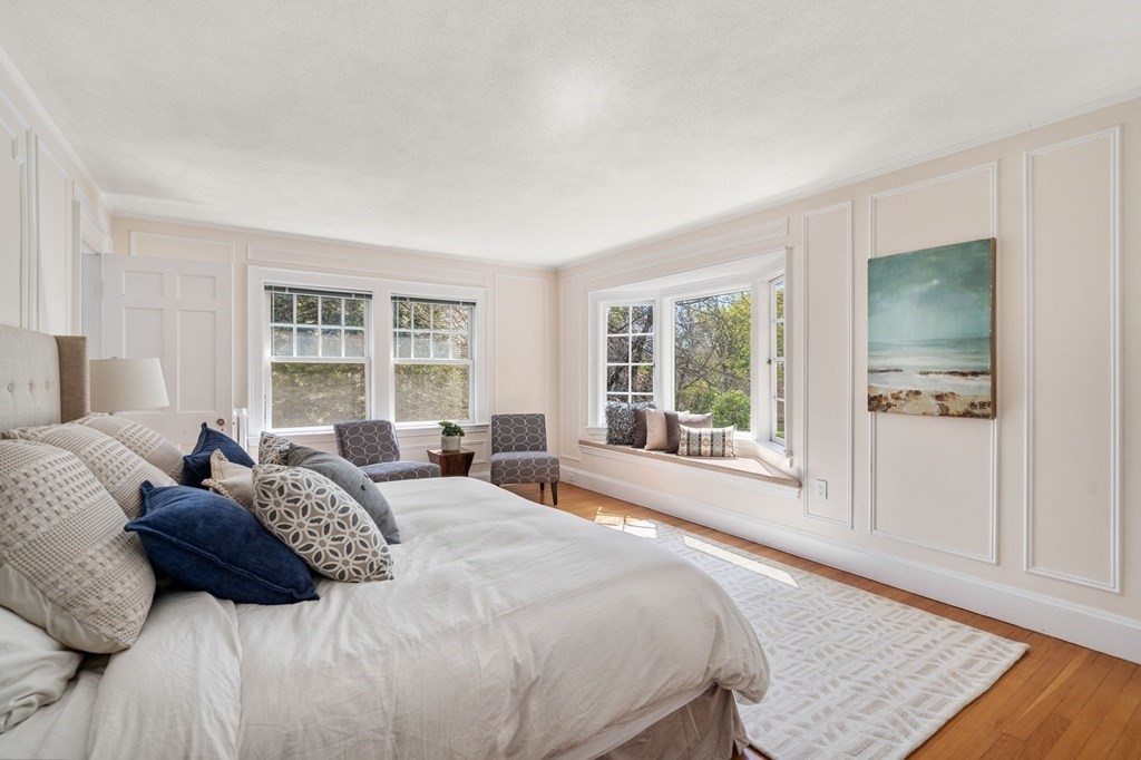 5 Hammond Street Newton, MA 02467 - Photo 28 of 40 a large bedroom with a large bed and a window