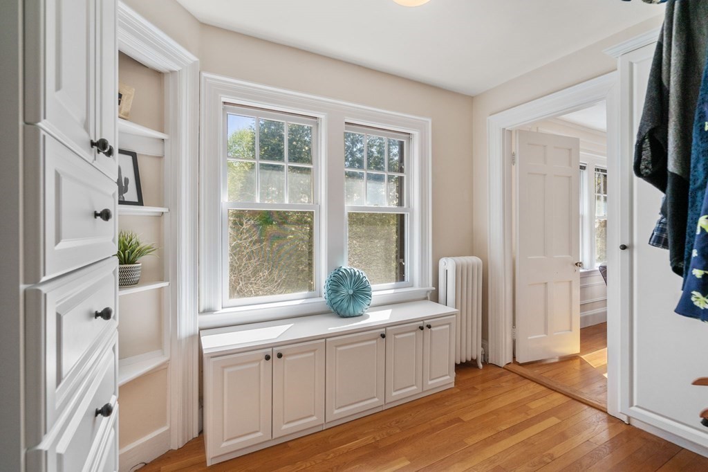 5 Hammond Street Newton, MA 02467 - Photo 29 of 40 a room with white cabinets and a window
