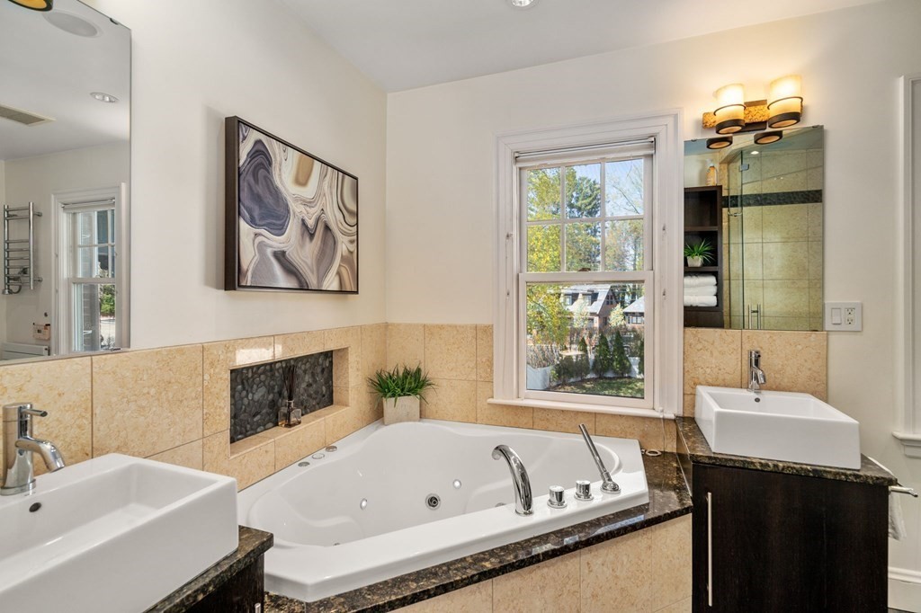 5 Hammond Street Newton, MA 02467 - Photo 30 of 40 a bathroom with a tub and a sink