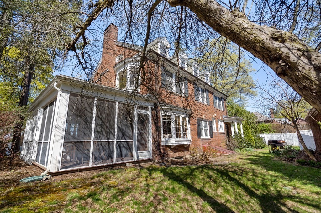 5 Hammond Street Newton, MA 02467 - Photo 36 of 40 a view of a house with a large window and yard