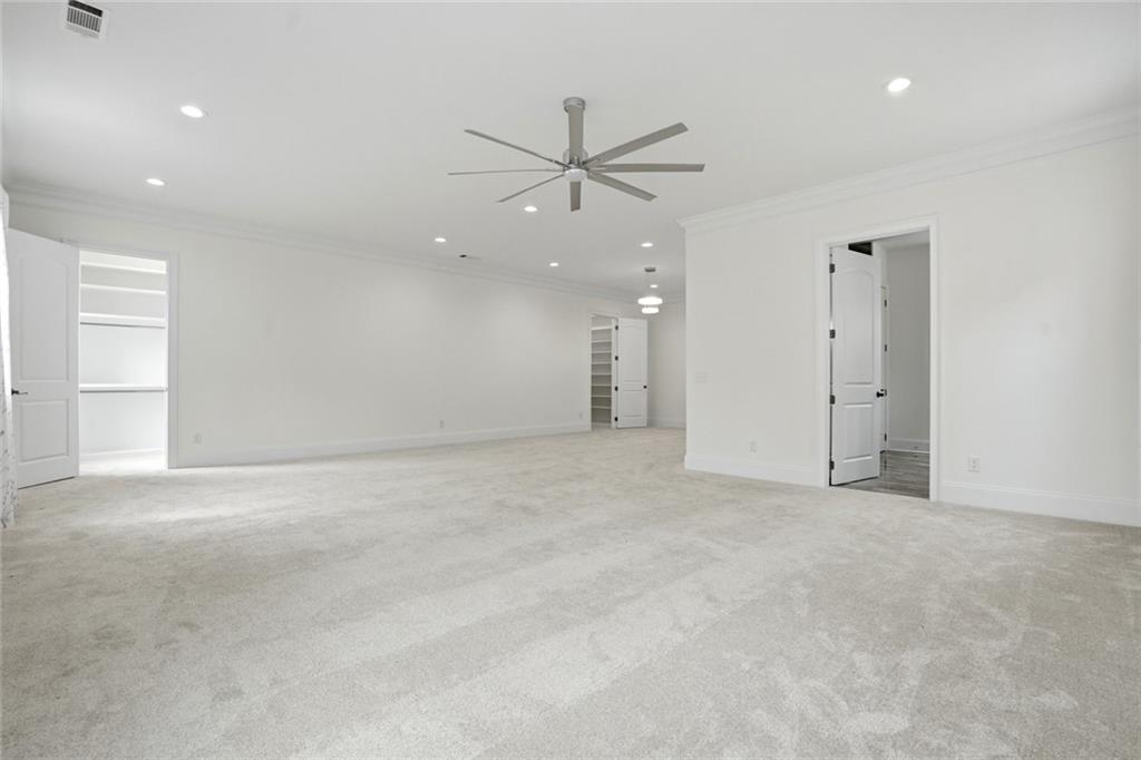 2415 West Rugby Avenue Atlanta, GA 30337 - Photo 15 of 40 an empty room with fan and a ceiling fan