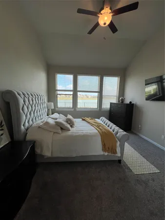 a bedroom with a bed and window