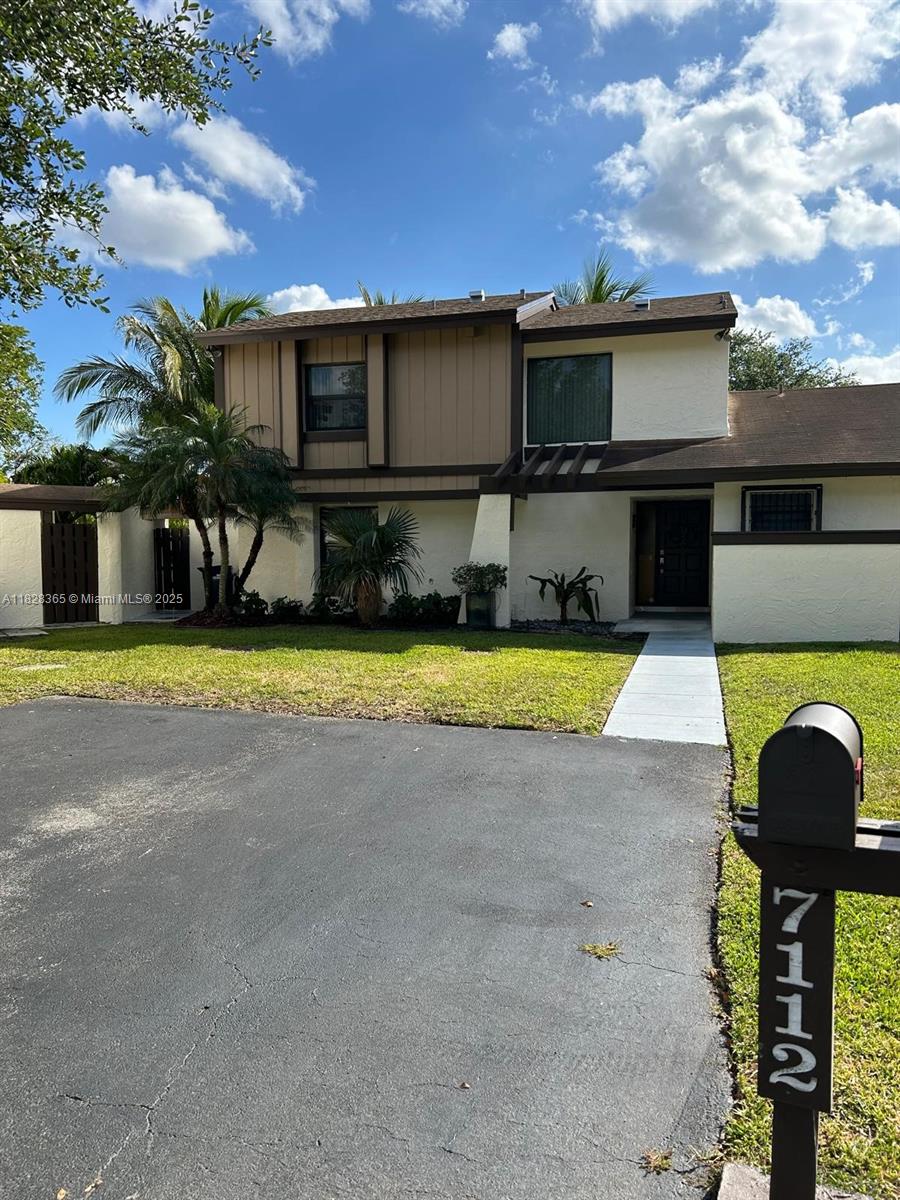 a view of a swimming pool with a yard