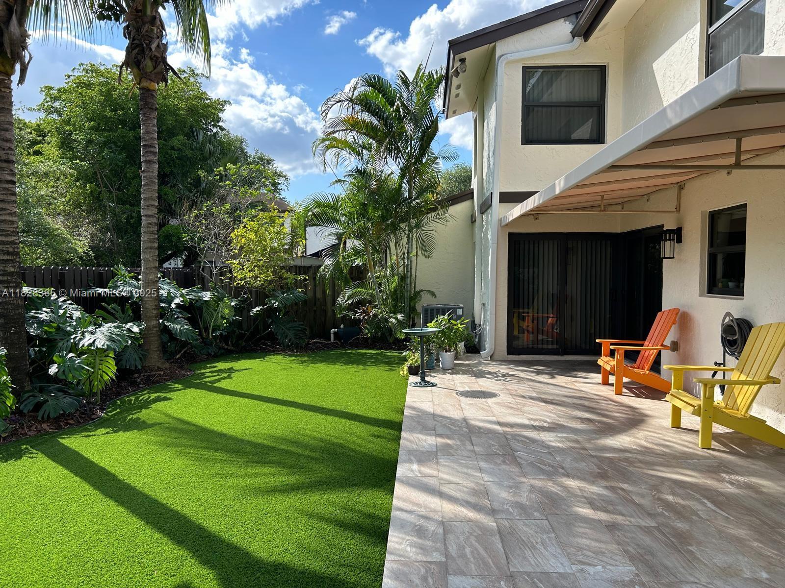 Kendale Lakes Miami, FL 33183 - Photo 11 of 12 a backyard of a house with seating space