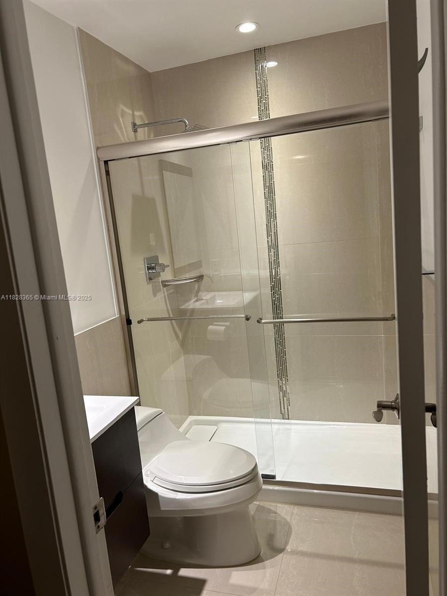 Kendale Lakes Miami, FL 33183 - Photo 6 of 12 a bathroom with a toilet and a shower