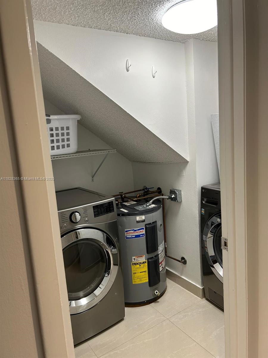 Kendale Lakes Miami, FL 33183 - Photo 9 of 12 a utility room with dryer and washer