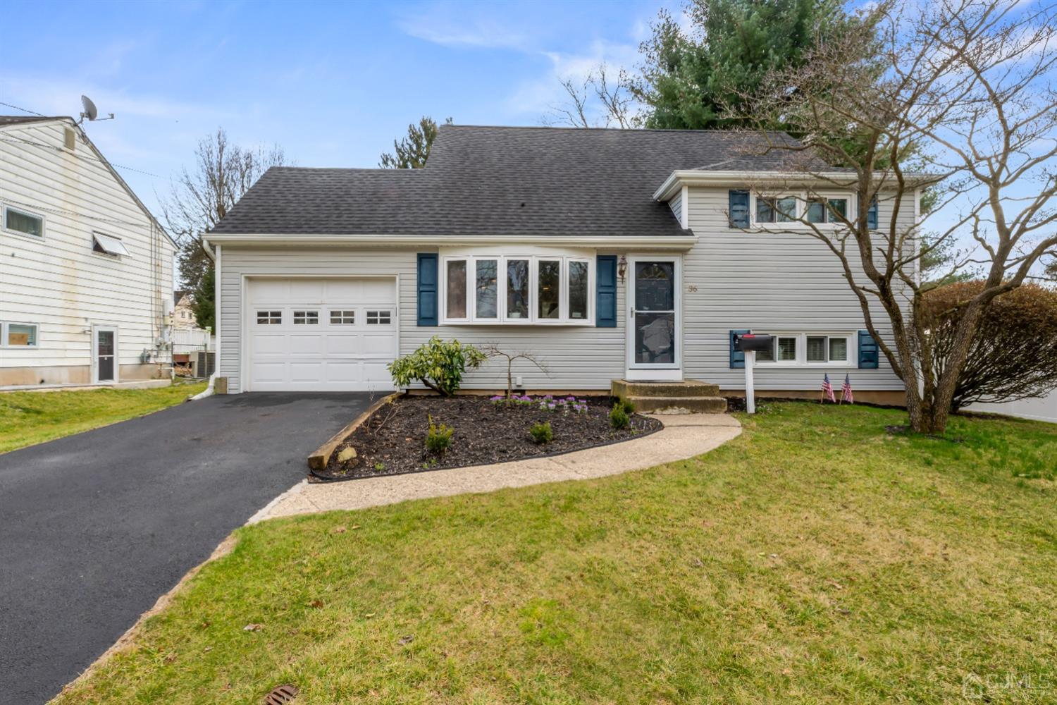 36 Shetland Road East Brunswick, NJ 08816 - Photo 1 of 22 a front view of a house with a yard and trees