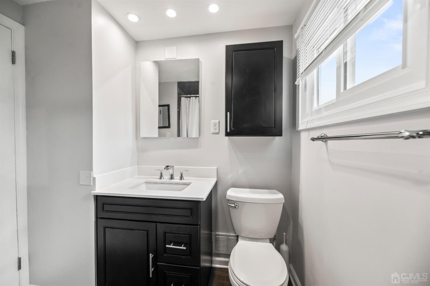 36 Shetland Road East Brunswick, NJ 08816 - Photo 7 of 22 a bathroom with a toilet sink and mirror