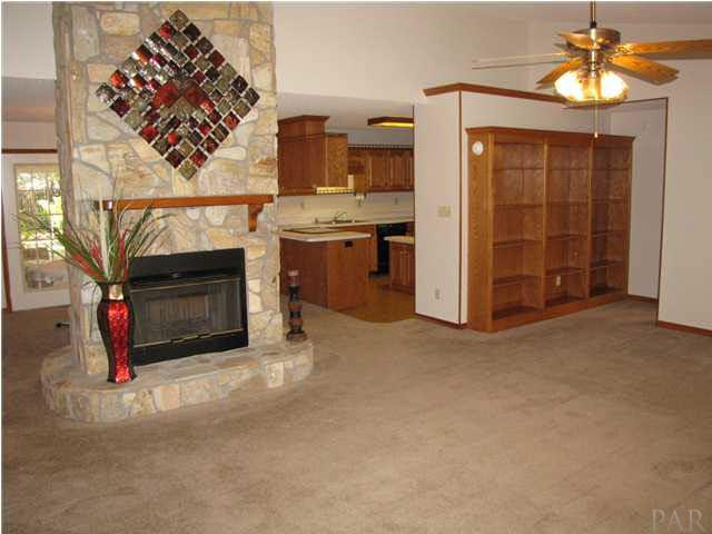 5736 Ridgefield Court Milton, FL 32583 - Photo 5 of 25 Double-sided Stone Fireplace & Built-in Bookshelves