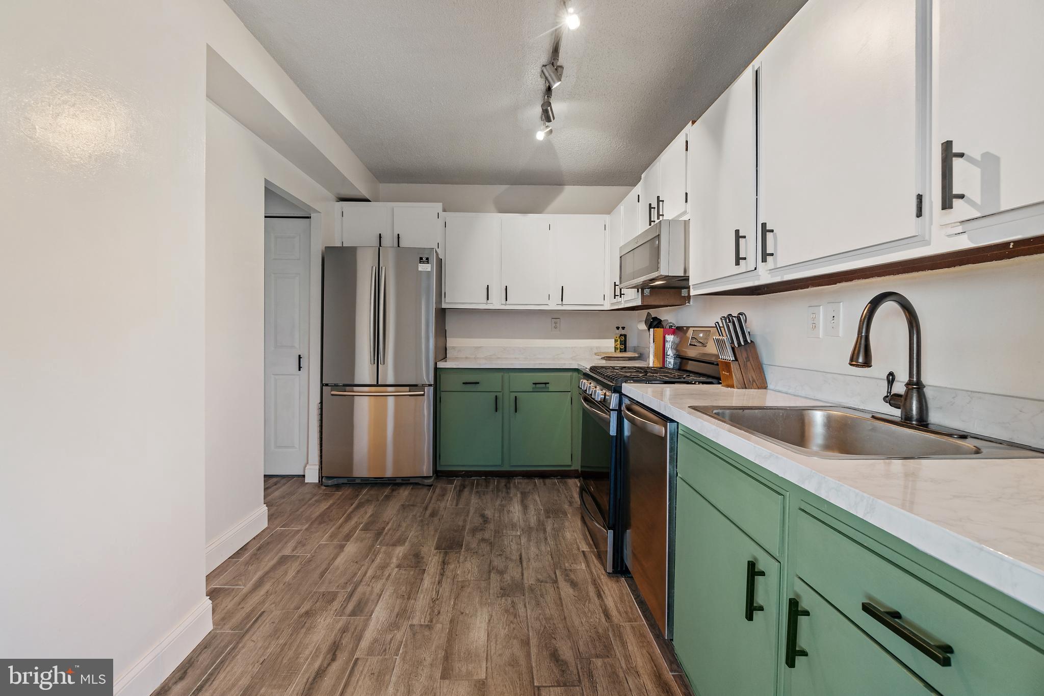 4401 Roland Avenue, Unit 507 Baltimore, MD 21210 - Photo 8 of 26 Updated kitchen includes ample cabinetry