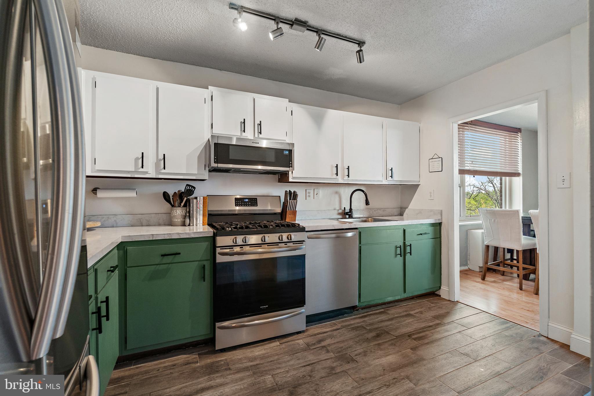 4401 Roland Avenue, Unit 507 Baltimore, MD 21210 - Photo 10 of 26 Updated kitchen includes tile floor