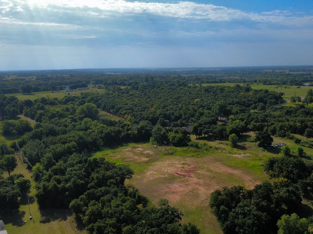 Pleasant Ridge Jones, OK 73049 - Photo 2 of 21 Expansive land parcel featuring open fields and mature tree coverage