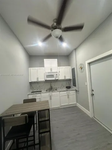 an empty room with wooden floor