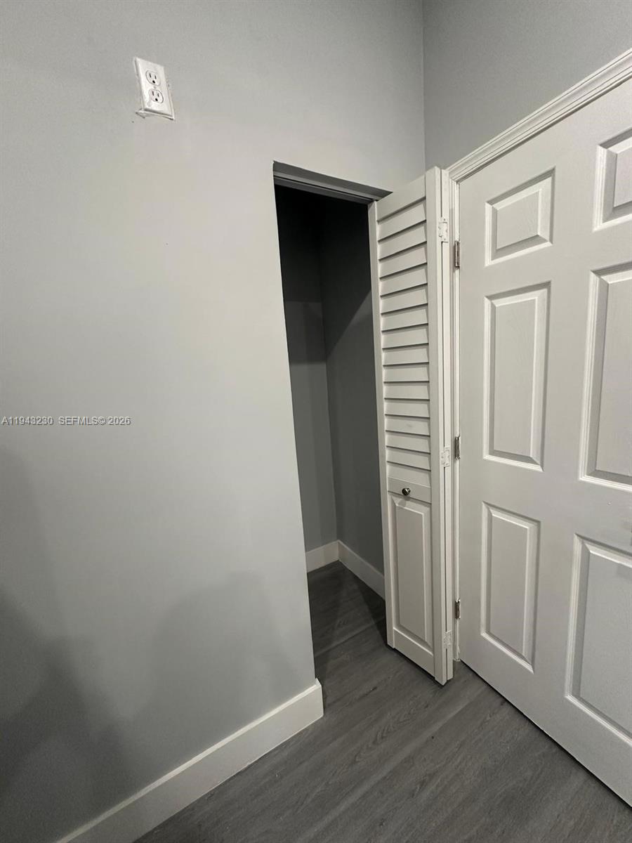 11879 Southwest 253rd Terrace Homestead, FL 33032 - Photo 13 of 15 an empty room with wooden floor