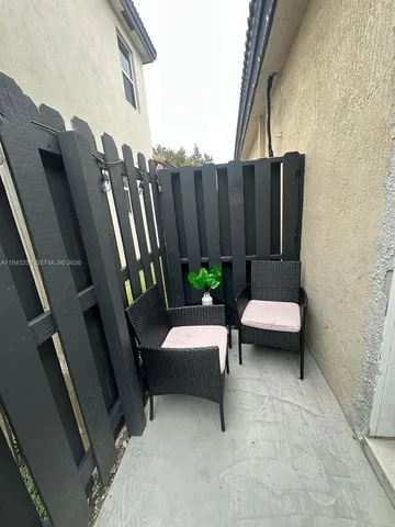 a view of balcony with outdoor seating and stairs