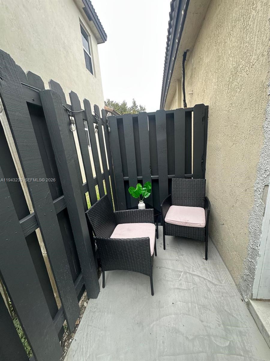 11879 Southwest 253rd Terrace Homestead, FL 33032 - Photo 4 of 15 a view of balcony with outdoor seating and stairs