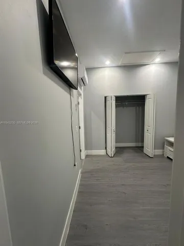 a very nice looking room with wooden floor and a sink