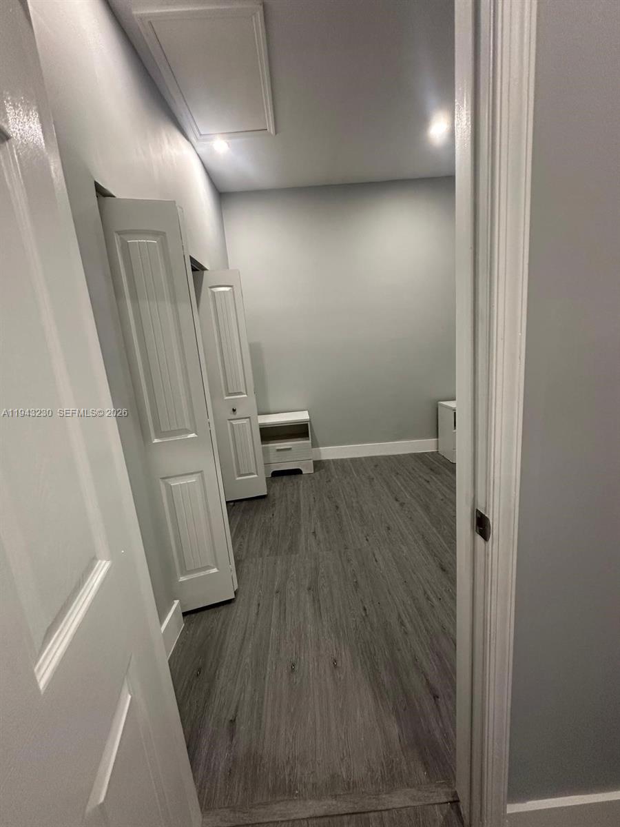 11879 Southwest 253rd Terrace Homestead, FL 33032 - Photo 9 of 15 wooden floor in an empty room