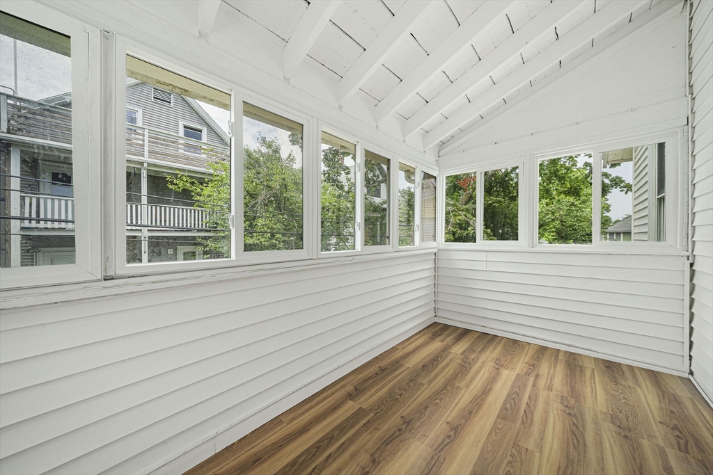 104 Greaton Road, Unit 2 Boston, MA 02132 - Photo 22 of 32 a view of a room with large windows