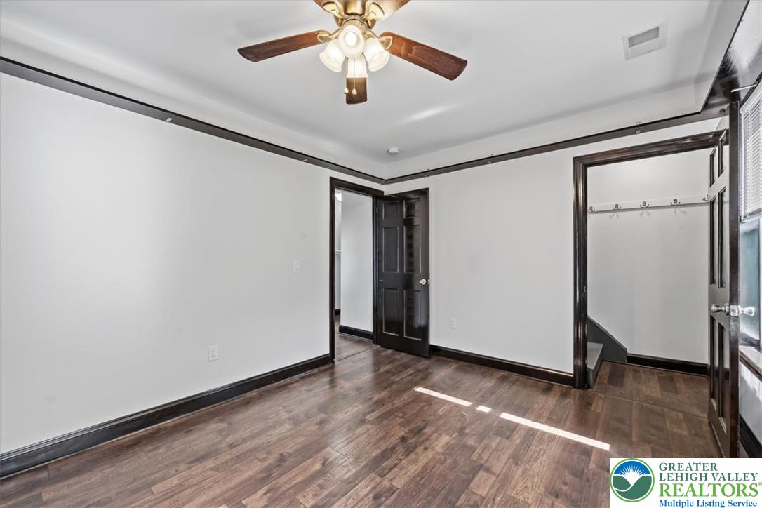 3453 Main Street Slatington, PA 18080 - Photo 18 of 30 Rich hardwood flooring and contrasting trim enhance this flexible living space.