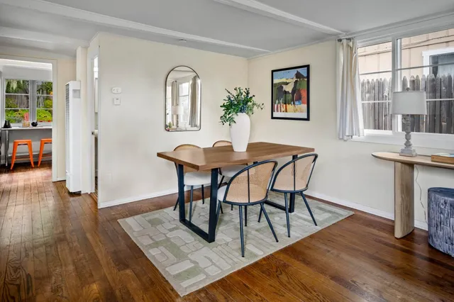 a view of a livingroom with furniture and window