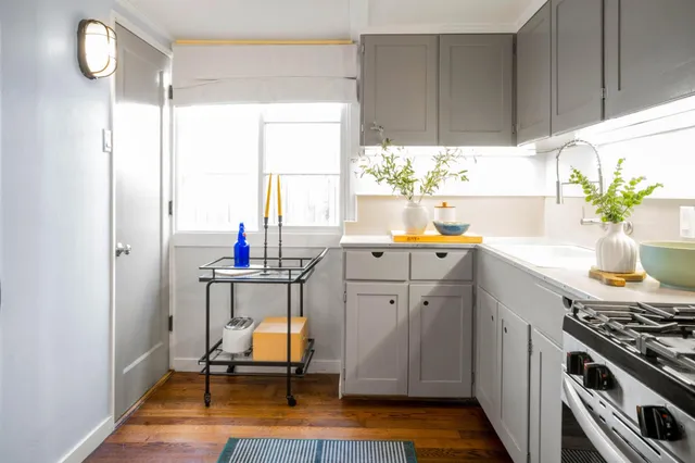 a kitchen with a sink cabinets and appliances