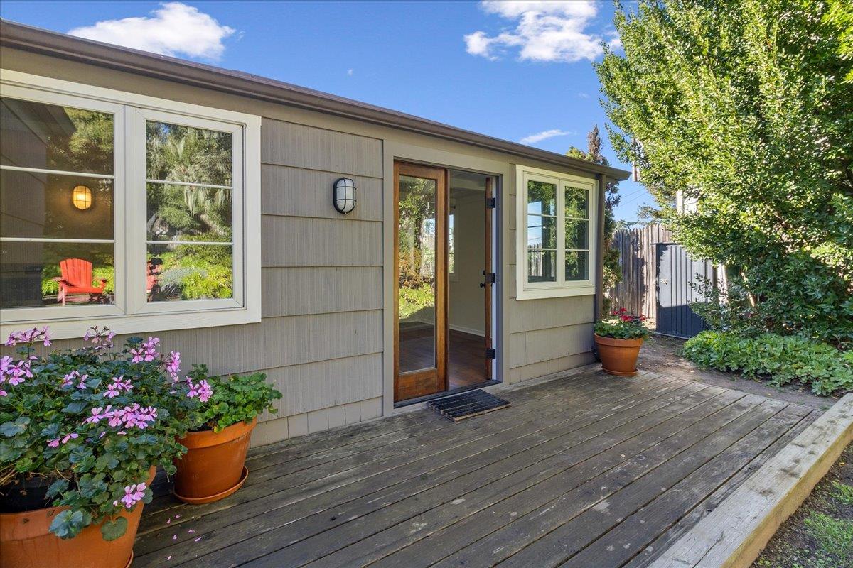 24747 Valley Way Carmel, CA 93923 - Photo 13 of 24 a view of a house that has wooden bench and flowers