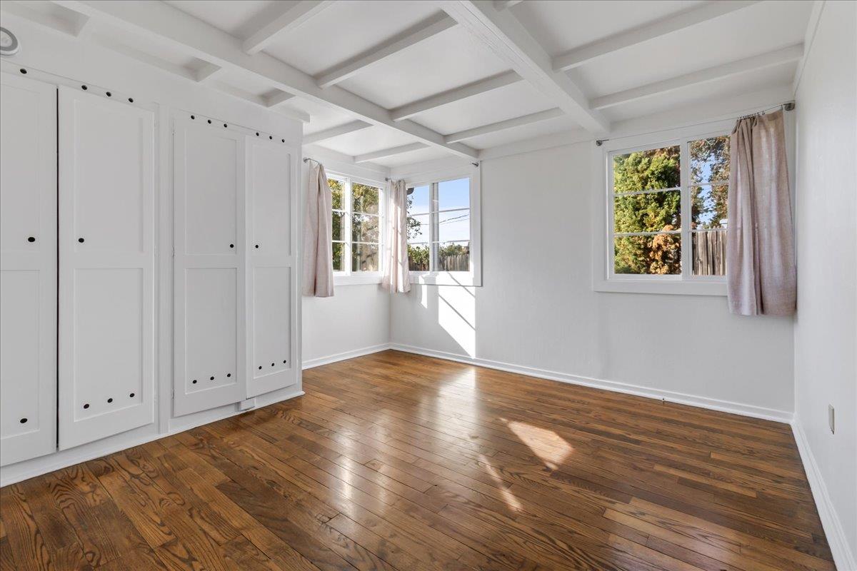 24747 Valley Way Carmel, CA 93923 - Photo 15 of 24 a view of an empty room with wooden floor and a window